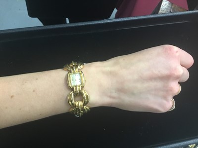 Lot 634 - Art Deco ladies Omega 18ct gold bracelet watch with Omega 15 jewel movement numbered 10483201, the rectangular dial with gold dot and dart hour markers, in gold case on gold bracelet, approximately...