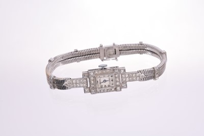 Lot 633 - Art Deco ladies diamond and platinum cocktail wristwatch by Harman, with Harman 17 jewel movement, the rectangular dial in tank shape platinum case with diamond bezel and pavé set diamond shoulders...