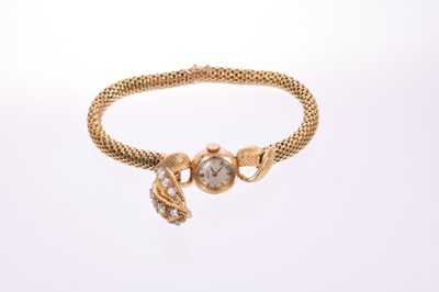 Lot 632 - 1950s ladies diamond and 18ct gold cocktail bracelet watch with concealed dial beneath textured gold leaves set with brilliant cut diamonds, the dial signed Juvenia, on snake link gold bracelet, th...