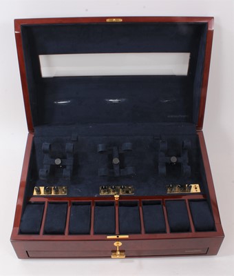 Lot 642 - Buben & Zōrweg 'Time Mover' watch winder, the electrically operated luxury watch winder designed to accommodate six wristwatches, in a glazed burr walnut effect cabinet with fitted drawer below. Ap...
