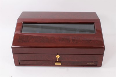 Lot 642 - Buben & Zōrweg 'Time Mover' watch winder, the electrically operated luxury watch winder designed to accommodate six wristwatches, in a glazed burr walnut effect cabinet with fitted drawer below. Ap...