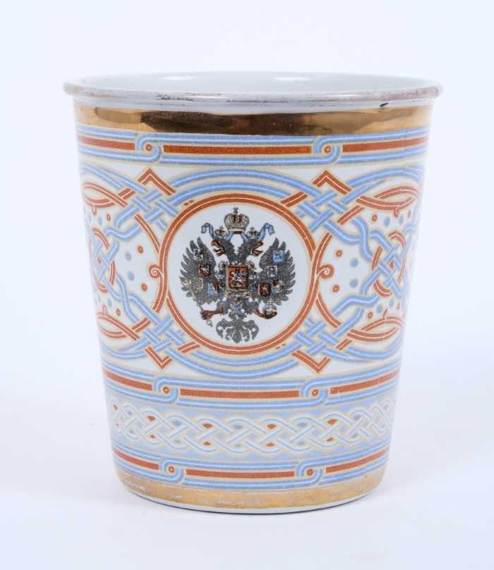 Lot 96 - Imperial Russian Tsar Nicholas II Coronation 1896 enamelled commemorative 'blood cup' beaker transfer decorated with the Imperial Russian eagle and Tsar Nicholas II cipher, on red,white and blue p...