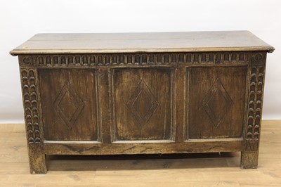 Lot 1473 - 18th century carved oak coffer, with plank top triple lozenge carved panel front on stiles, 126cm wide x 50cm deep x 67cm high