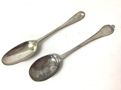 Lot 433 - William III Britannia standard silver trefid spoon with dog nose handle, engraved initials and reeded rat tail terminal to the bowl by Lawrence Cole, London 1700, together with a George I Britannia...