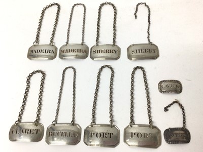 Lot 440 - Ten Georgian silver spirit labels