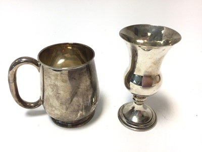 Lot 427 - George V silver christening mug of baluster form with loop handle, on a circular foot, (Sheffield 1920), maker Cooper Brothers & Sons Ltd, together with a Contemporary silver Kiddush cup of convent...