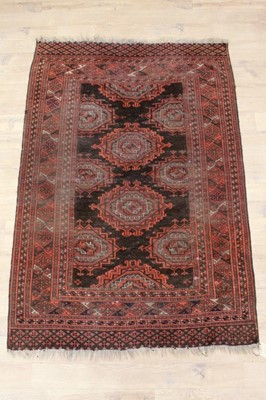 Lot 1518 - Tekke style rug, with stepped medallions on chocolate ground in multiple geometric borders, 176 x 122cm, together with two machined runners, 403 x 77cm and 355 x 85cm