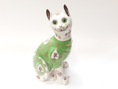 Lot 1181 - Galle style pottery cat with floral decoration