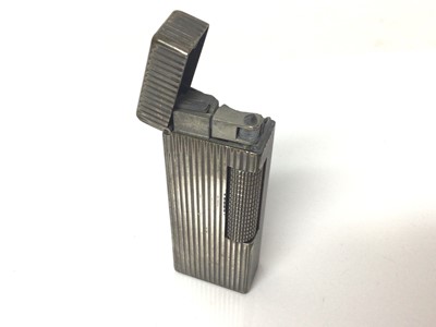 Lot 95 - Dunhill silver plated lighter with ribbed case
