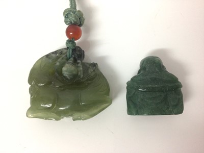 Lot 96 - Chinese carved green hardstone figure of a horse, 4.5cm wide, on a woven necklace with polished beads, together with a carved hardstone Buddha (2)