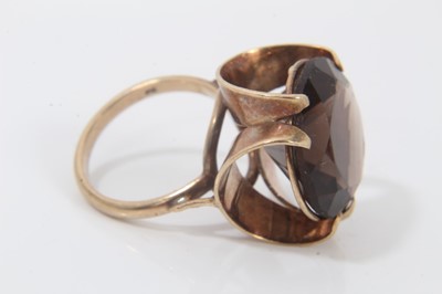 Lot 336 - 9ct gold smoky quartz cocktail ring in stylised gold setting