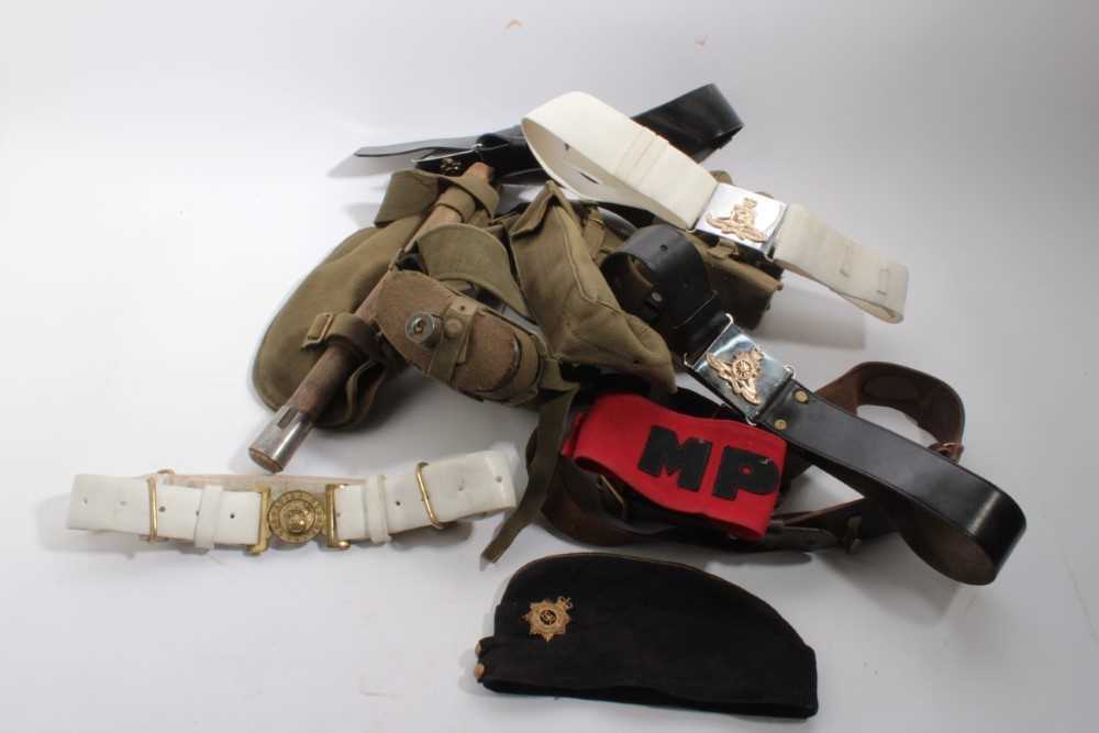 Lot 864 - Second World War canvas webbing belt with waterbottle and various pouches, together with a Sam Browne belt, Grenadier Guards brass belt buckle on white belt, other military belts