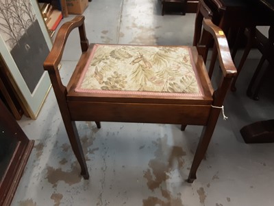 Lot 1016 - Piano stool with arms and floral seat