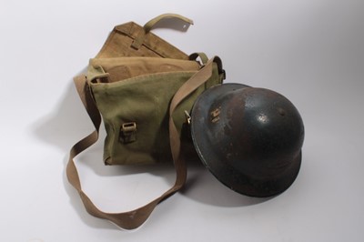 Lot 869 - Second World War Police steel helmet, marked under brim XNII HBH 1939, together with a canvas webbing bag (2)