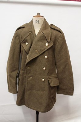 Lot 899 - Second World War Gas Mask in case, 1950's Great Coat, dated 1953, American Air Force Jacket and R.A.F. trousers, dated 1953