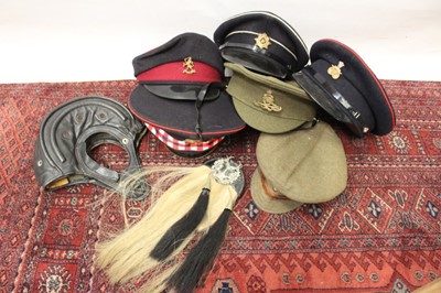 Lot 902 - Group of seven various Military hats to include a leather Soviet tank crew helmet, a 1920's Royal Artillery hat, other various hats and a leather sporran (6)