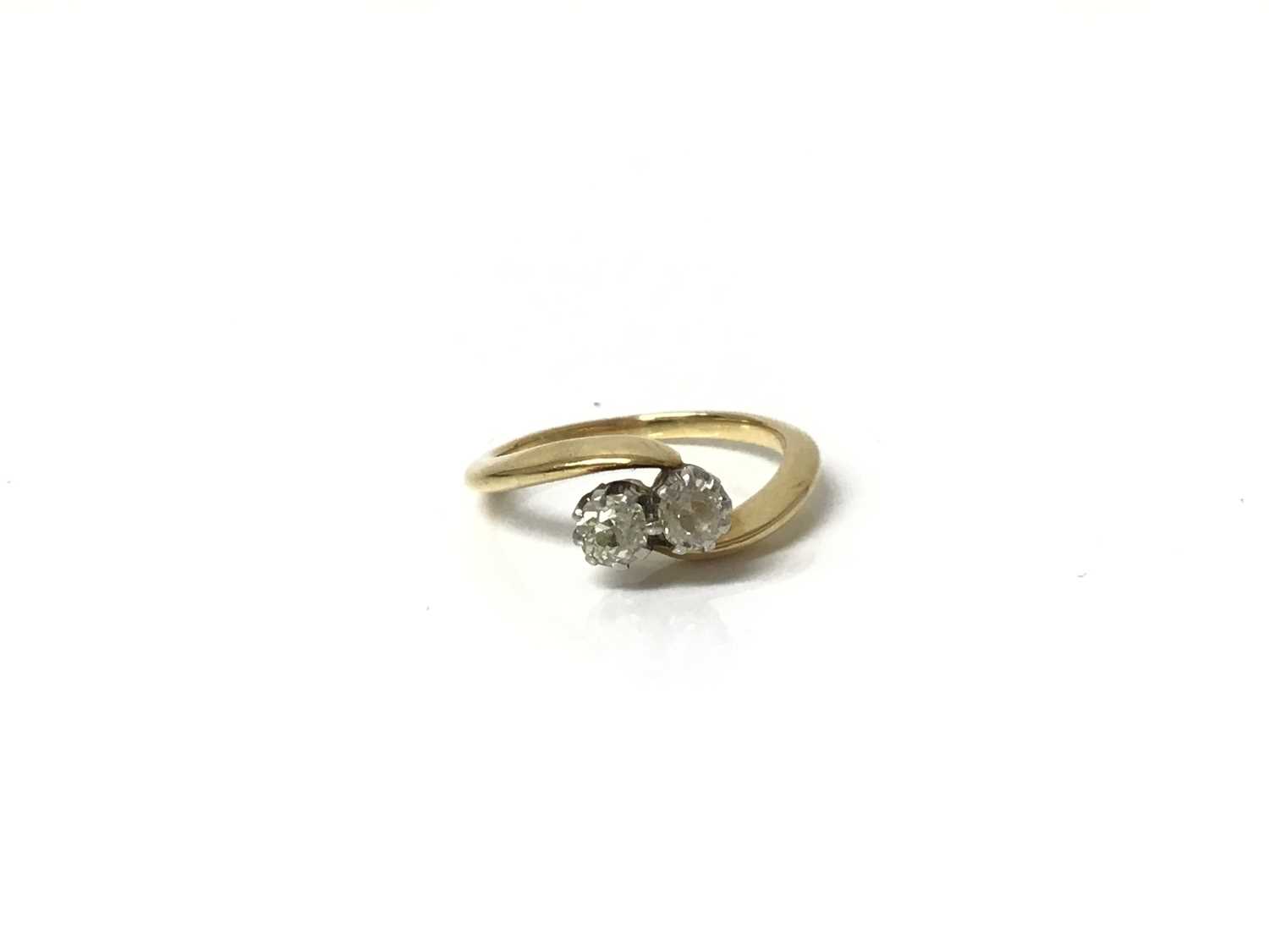 Lot 90 - Diamond two stone crossover ring with two old cut diamonds in claw setting on gold shank. Ring size J