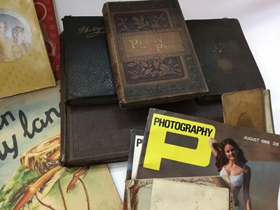 Lot 1448 - One box of mixed ephemera to include albums of photographs of auction posters, James Bond book and other items