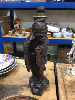 Lot 14 - Three good carved wood Chinese stands and a Chinese carved wood figure converted to a lamp