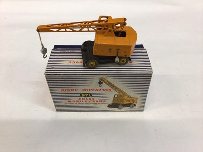Lot 1850 - Dinky Supertoys Coles Mobile Crane No. 971 and Muir - Hill Dumper Truck No. 962 and a Heavy Tractor No. 563, all boxed (3)