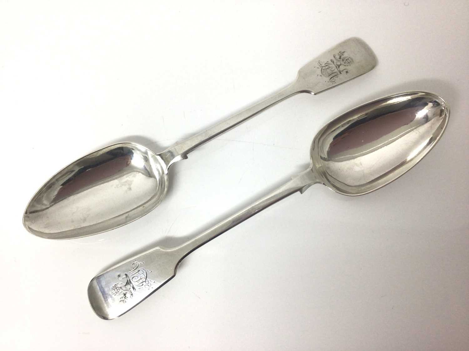 Lot 59 - Pair of Victorian Scottish silver fiddle pattern table spoons with engraved crest and monograms, approximately 5ozs