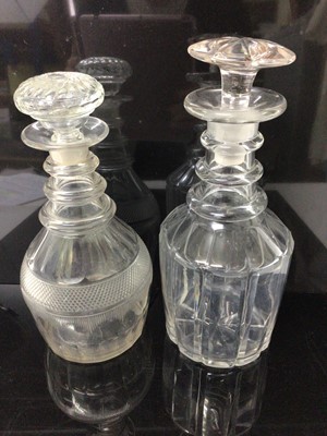Lot 56 - Two Georgian cut glass ring neck decanters
