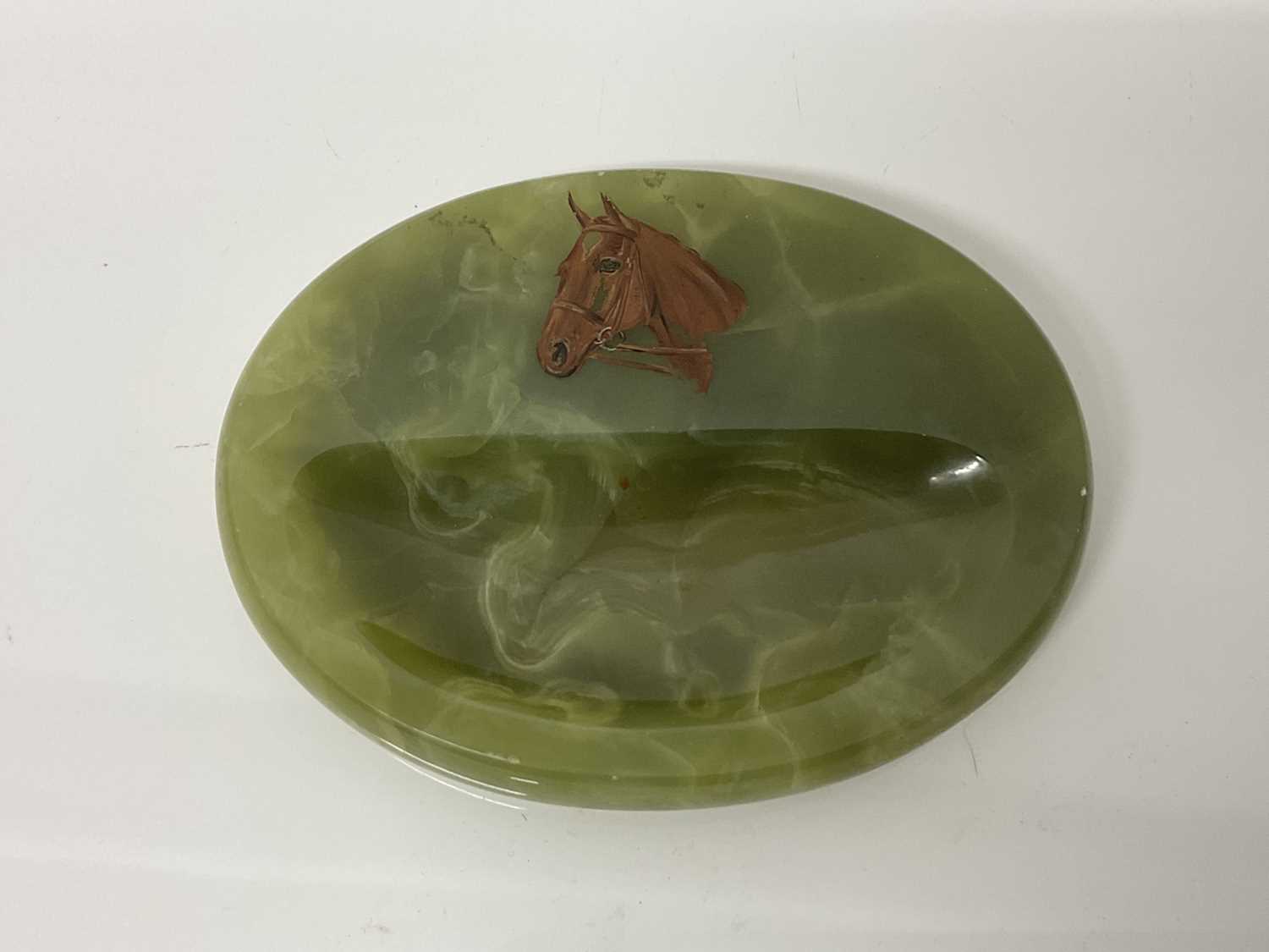 Lot 54 - Early 20th century green onyx pin dish of oval form painted with the head of a horse, 11cm x 14cm