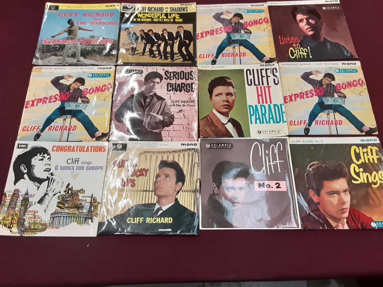 Lot 2229 - Vintage case of 30 Cliff Richard EP's, together with a vintage case of single records on the Coral and Coral Vogue label, including The Crickets, Jackie Wilson, Cozy Cole and Billy Williams, some d...