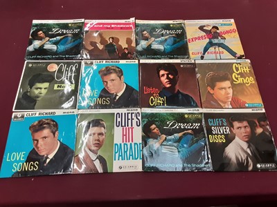 Lot 2229 - Vintage case of 30 Cliff Richard EP's, together with a vintage case of single records on the Coral and Coral Vogue label, including The Crickets, Jackie Wilson, Cozy Cole and Billy Williams, some d...