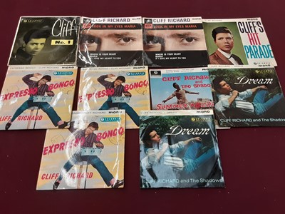 Lot 2229 - Vintage case of 30 Cliff Richard EP's, together with a vintage case of single records on the Coral and Coral Vogue label, including The Crickets, Jackie Wilson, Cozy Cole and Billy Williams, some d...