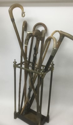 Lot 298 - Victorian brass stick stand together with a group of various sticks