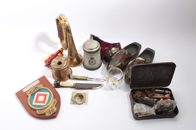 Lot 930 - Collection of assorted militaria to include Second World War A.R.P. Whistle, folding knives, Parachute Regiment Sable belt, brass bugle and other items (1 box)