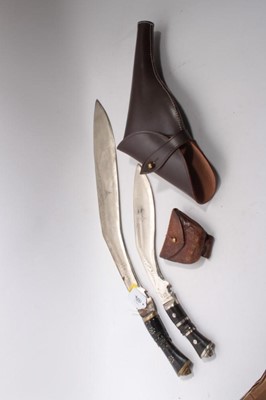 Lot 1034 - Very large Gurkha Kukri, the blade 51cm in length marked India, together with another Kukri, brown leather holster and a First World War Officers' ammounition pouch by F. H. Ayres Ltd, London 1915...