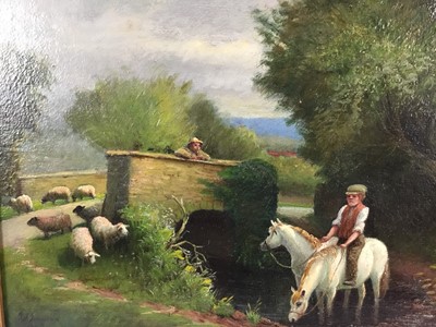 Lot 143 - J.J. Johnson, oil on canvas, 
A country scene with horses and sheep by a bridge over 
a stream, signed and dated 1909, in gilt 
frame. 31 x 41cm.