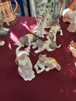 Lot 1183 - Collection of eight Lladro and NAO animal ornaments, including cats, dogs and geese