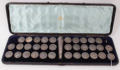 Lot 399 - Collection of thirty four Dutch white metal buttons and handle in fitted case