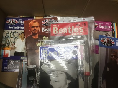Lot 2259 - Beatles fan club magazines Issues 12-70 and Beatles Monthly Book 1963-1969 together with a box of Beatles and Merseabeat merchandise (2 boxes)