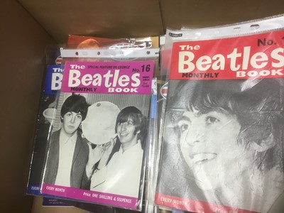 Lot 2259 - Beatles fan club magazines Issues 12-70 and Beatles Monthly Book 1963-1969 together with a box of Beatles and Merseabeat merchandise (2 boxes)