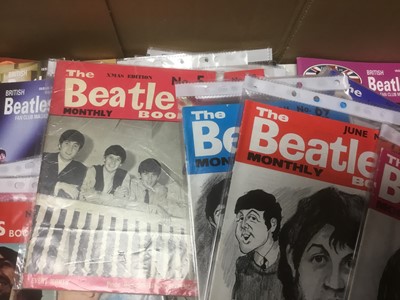 Lot 2259 - Beatles fan club magazines Issues 12-70 and Beatles Monthly Book 1963-1969 together with a box of Beatles and Merseabeat merchandise (2 boxes)