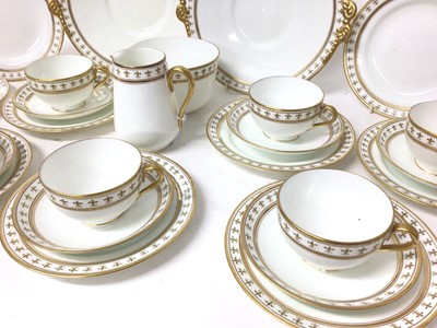 Lot 68 - Adderleys Ltd. porcelain teaset, Rouen pattern eleven place setting with two cake plates, milk jug and sugar bowl, each decorated with borders of fleur-de-lis (37 pieces)