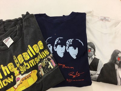 Lot 2268 - Box of tee shirts and sweat shirts including The Who, Beatles, Stones etc. Together with selection of posters of film and music genres (2 boxes)