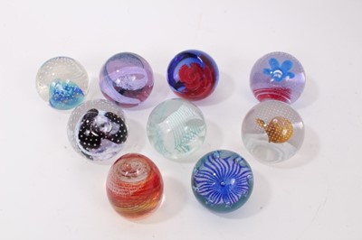 Lot 1220 - Nine Caithness Paperweights including reflections 93, 94, Pop Flowers, Red Carnation, Pastel, Petuna, Sands of time, Trapeze and Gentleheart (9)