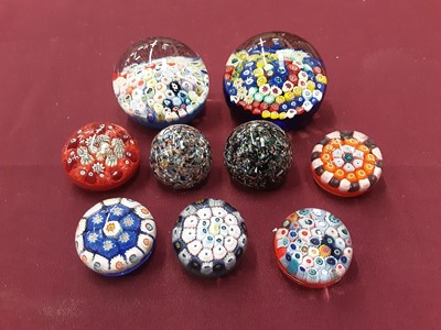 Lot 1213 - Nine Strathearn paperweights including x5 miniature Millefiori, x2 Aura and x2 End of Day Paperweights (9)