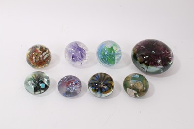 Lot 1221 - Eight Isle of Wight Glass Paperweights including a large Flower paperweight by Michael Harris circa. 1976 (8)