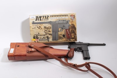 Lot 1079 - Airsoft Pistol- KWC M712 Mauser broom handle style BB gun in box with accessories