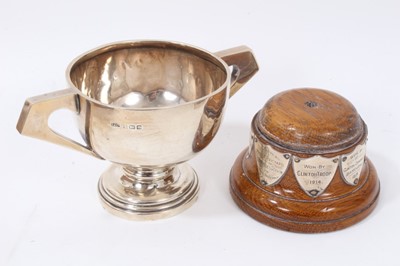 Lot 148 - George V silver trophy cup, Birmingham 1913, on two turned wood bases mounted with Girl Guides related plaques, together with a George V silver cigarette box, Birmingham 1927