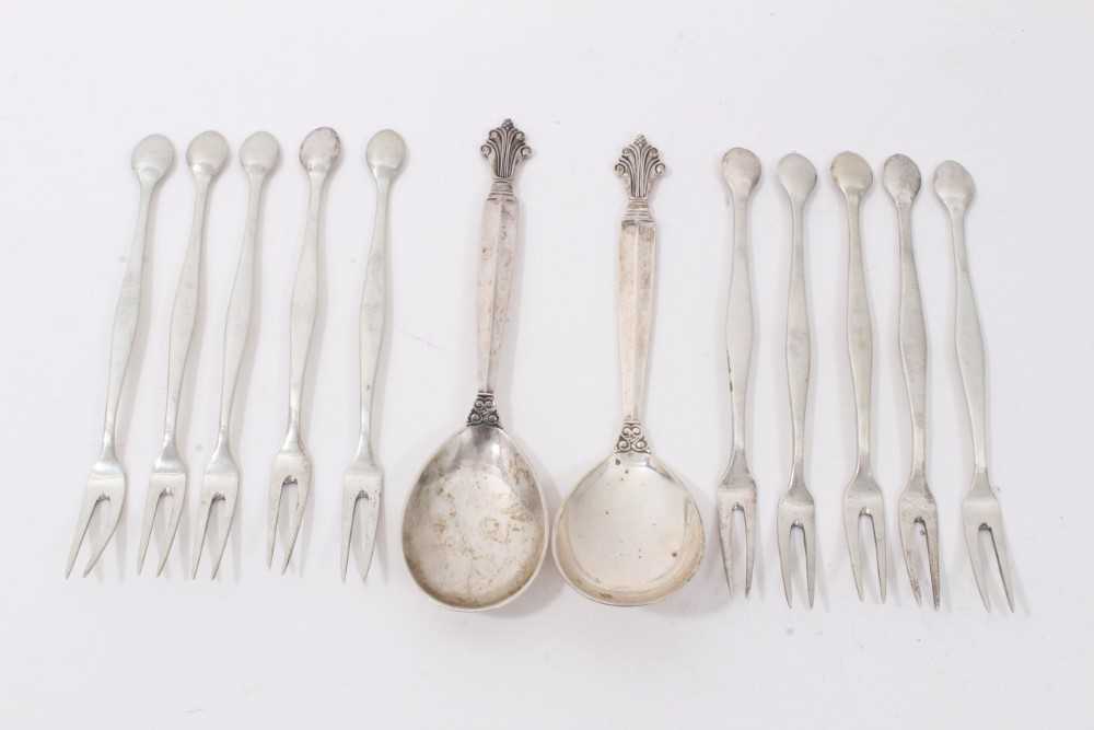 Lot 156 - Pair of Georg Jensen silver spoons, together with ten French silver crab/lobster forks (12 pieces)