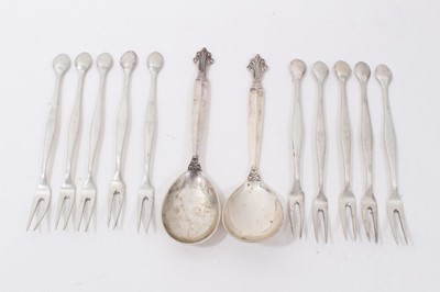 Lot 156 - Pair of Georg Jensen silver spoons, together with ten French silver crab/lobster forks (12 pieces)
