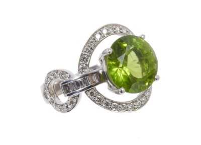 Lot 624 - Peridot and diamond cluster ring