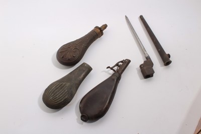 Lot 1046 - Second World British military spike bayonet, two brass powder flasks and a leather shot flask (4)